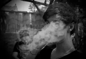Photo of boy blowing lots of smoke